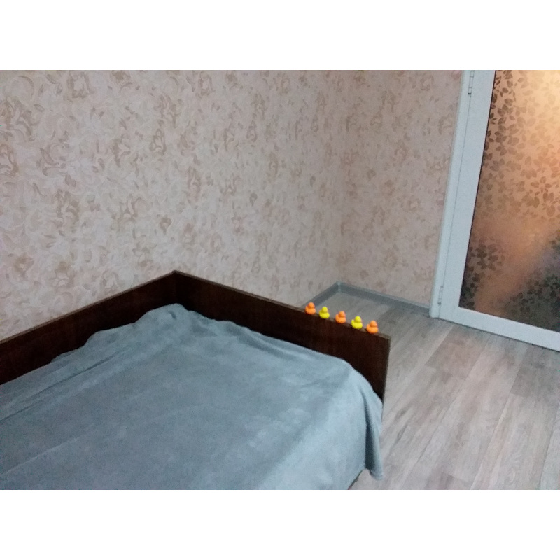 part of a bedroom with ordinary bed