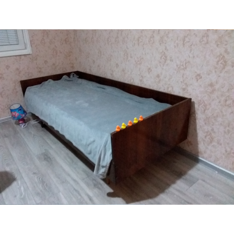 part of a bedroom with ordinary bed