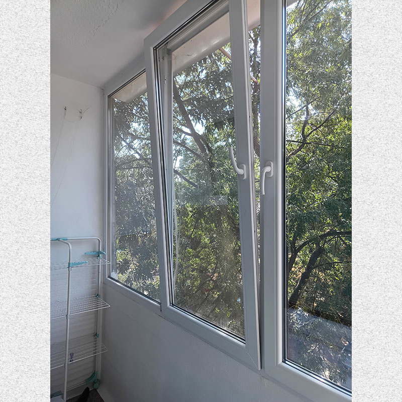 picture of  a sunny south terace with  big windows 