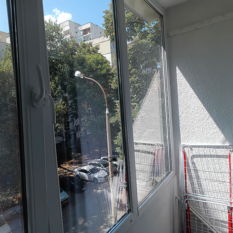 picture of  a sunny south terace with  big windows